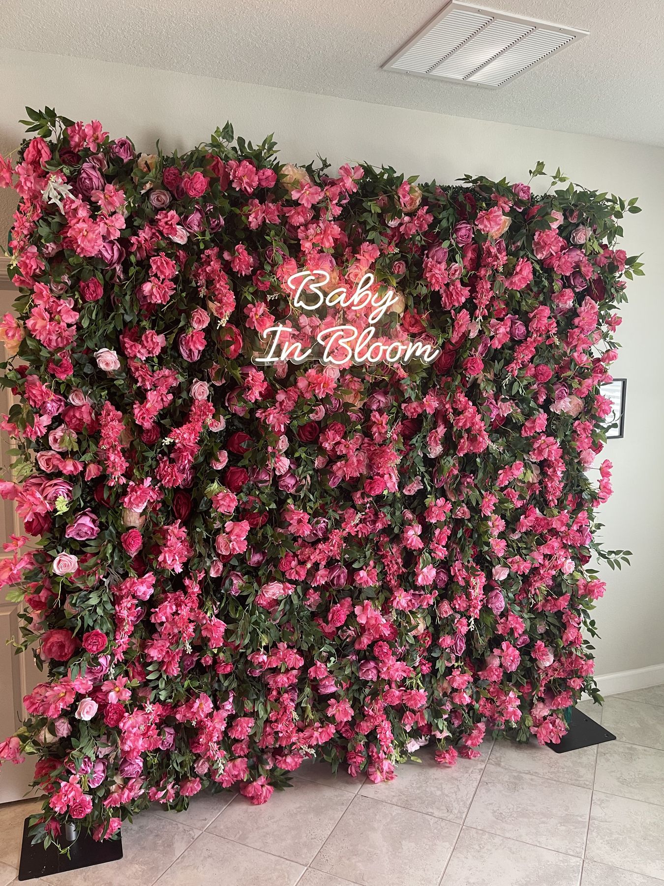 Dhalia Pink flower wall rental, the full panel with a Baby In Bloom sign, for a Lakeland shower
