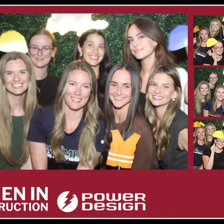 Corporate team at the mirror photo booth with a hedge wall backdrop in Tampa