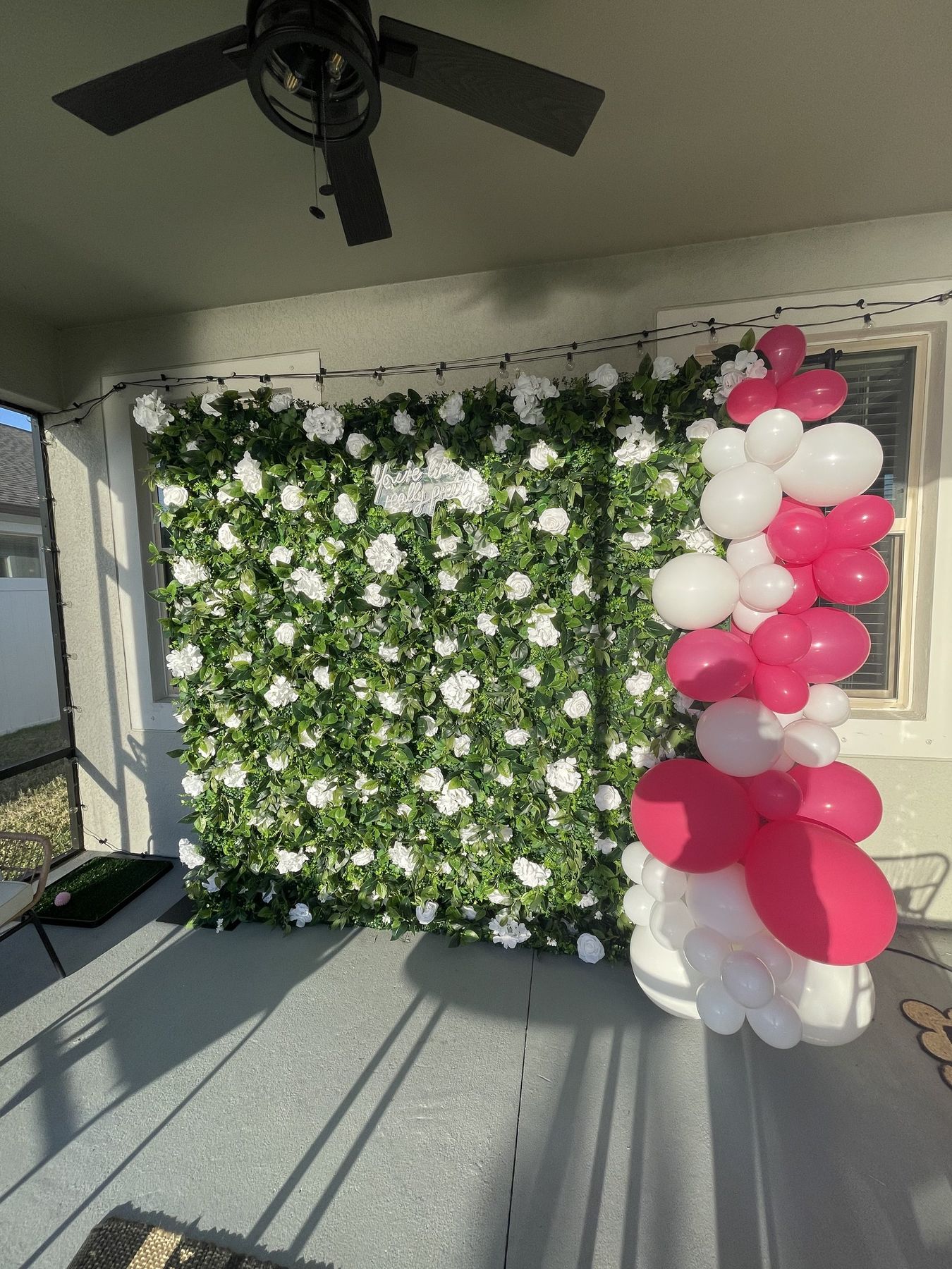 Balloon garland on a flower wall, a party add-on for a Tampa quinceañera